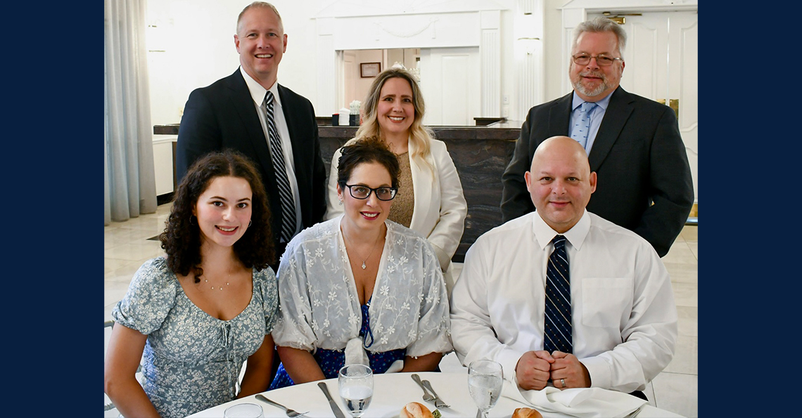 Valedictorian Amanda Seligman with staff